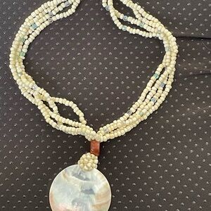 Elegant Cream Beaded Necklace with Shell Pendant
